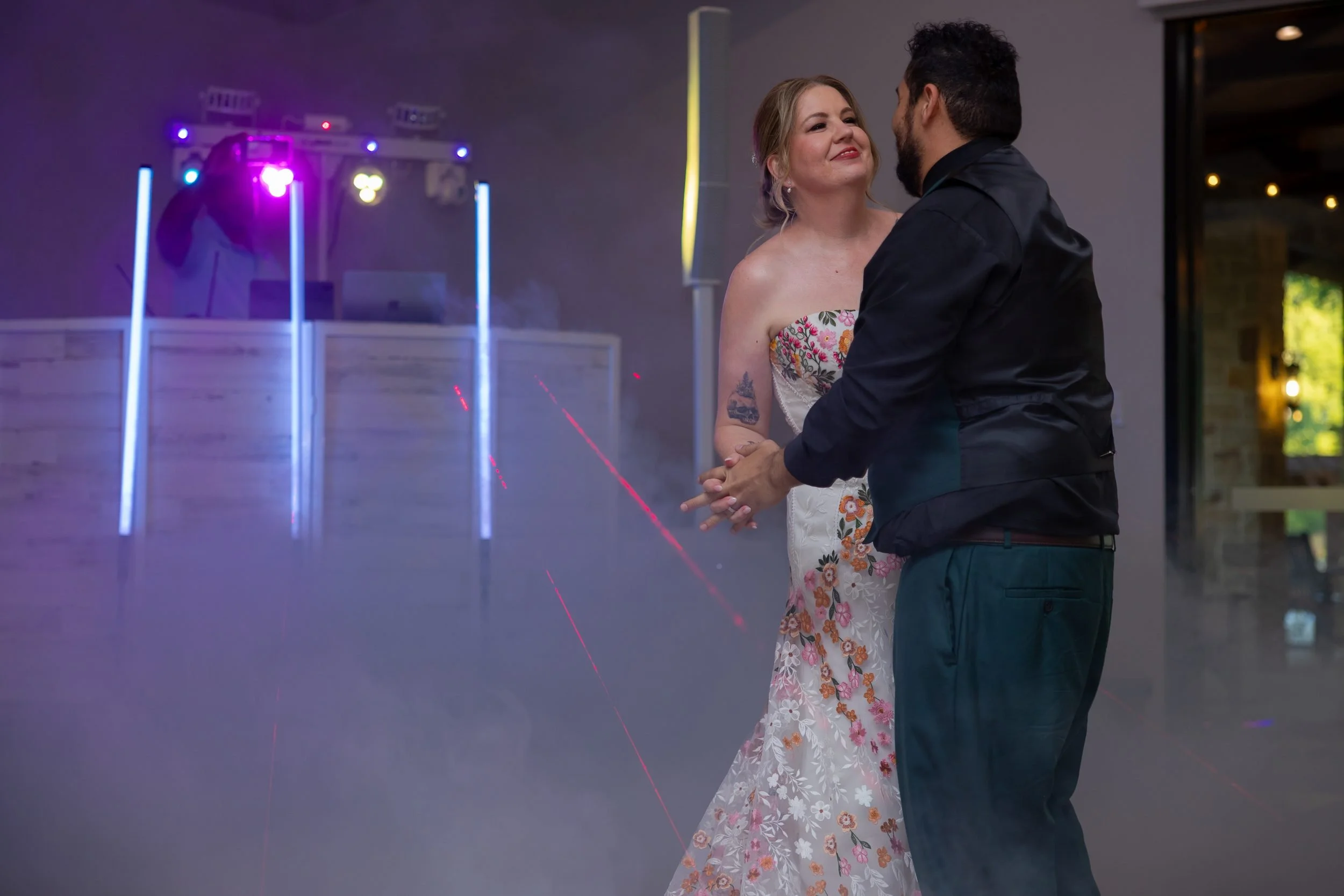 Carita and Miguel's first dance under purple lights at The Orchard reception