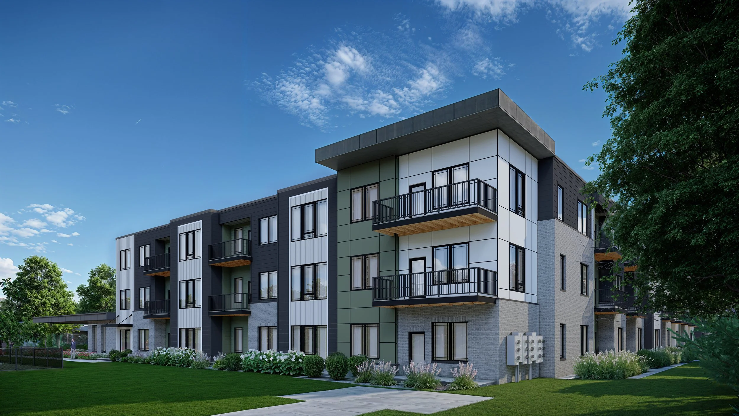 Modern multi-story residential building with balconies, surrounded by green trees and a well-manicured lawn under a partly cloudy blue sky.