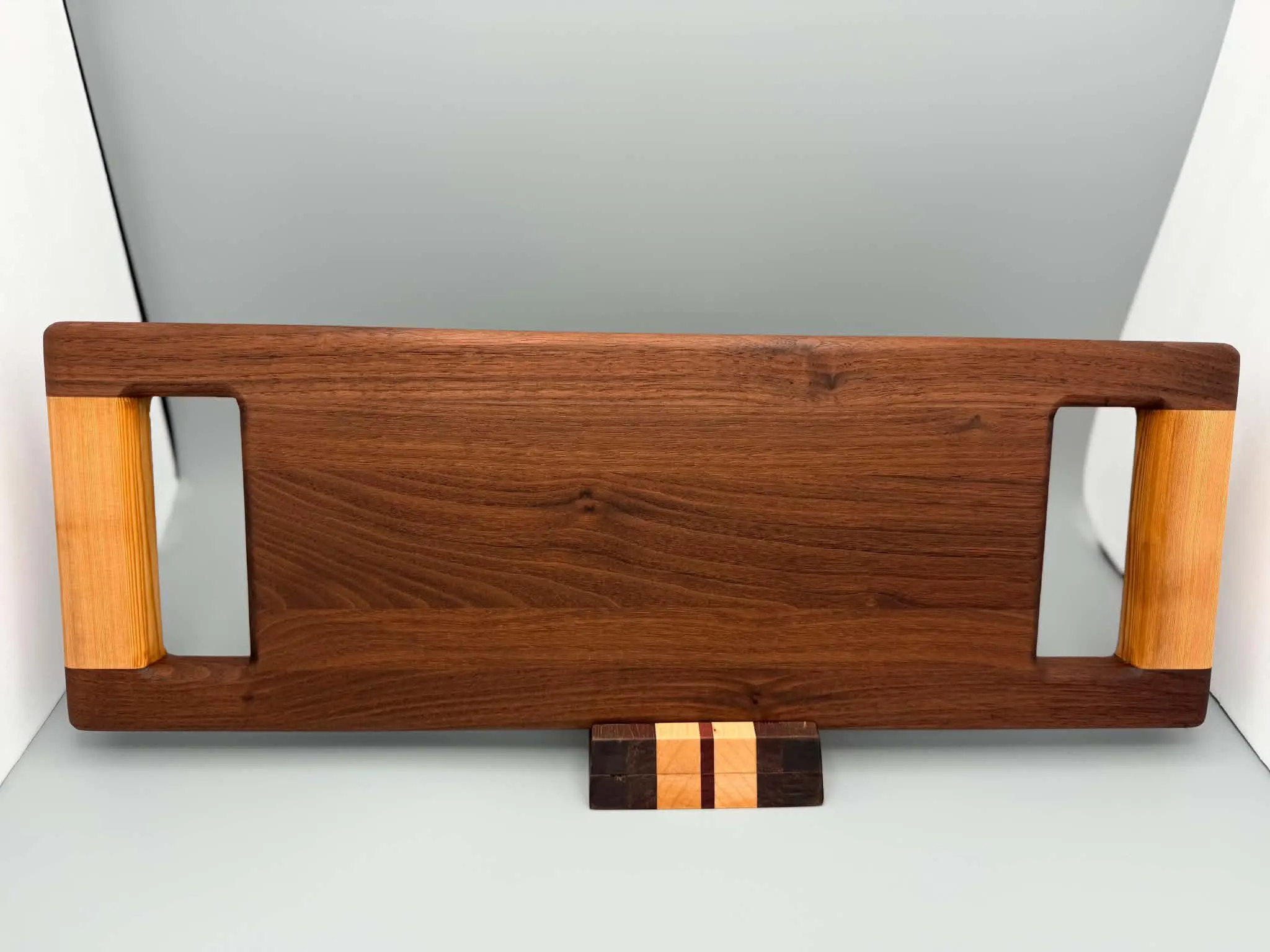 Walnut serving board
Handcrafted walnut serving board with contrasting cypress handles.
