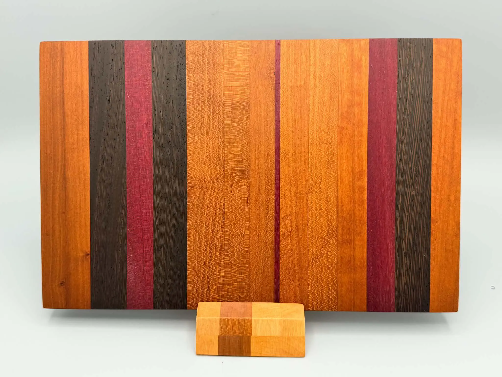 Mixed hardwood board
Handcrafted mixed hardwood cutting board made from cherry, wenge, and purpleheart.