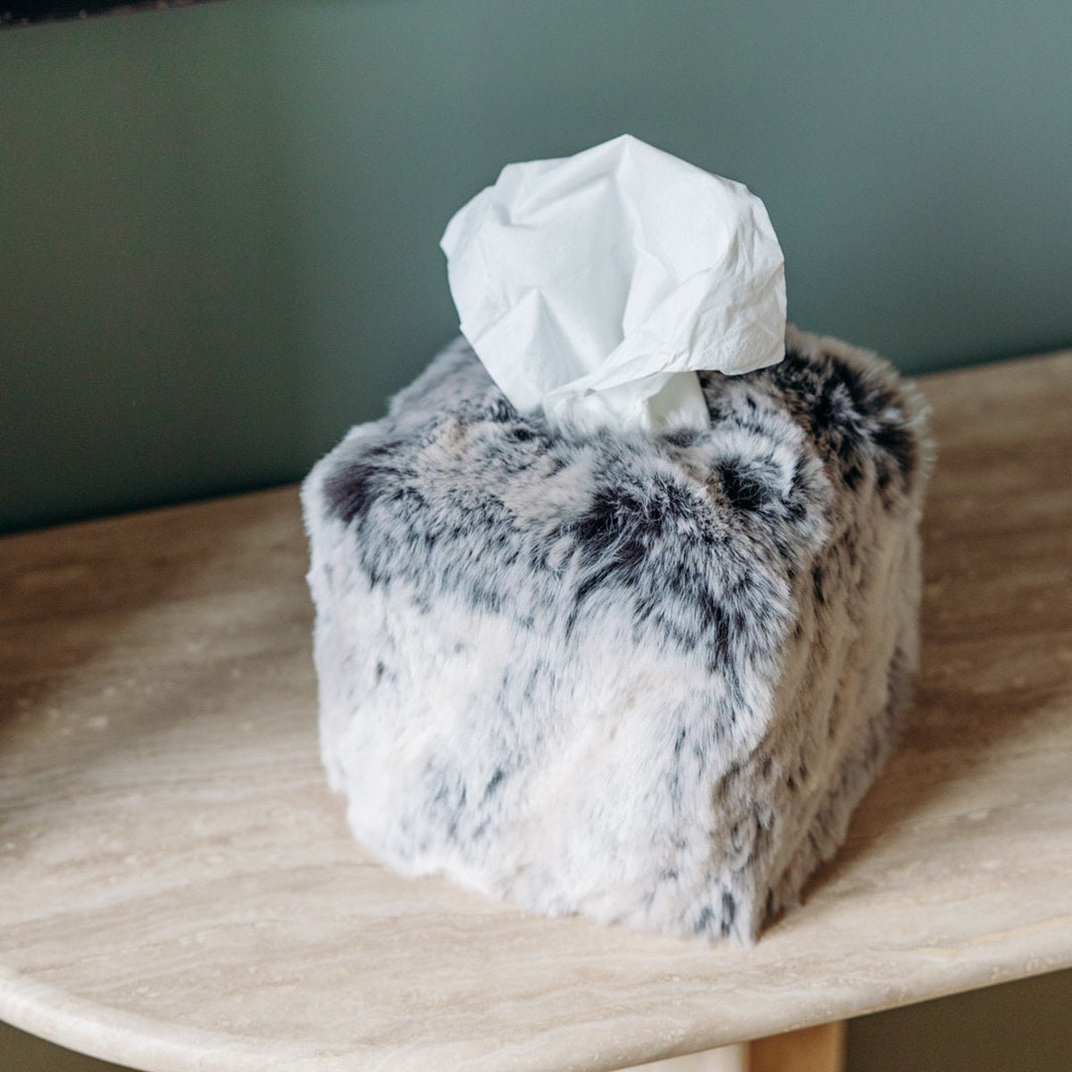 Square Glacier faux fur tissue box cover by Evelyne Prélonge on a stone side table