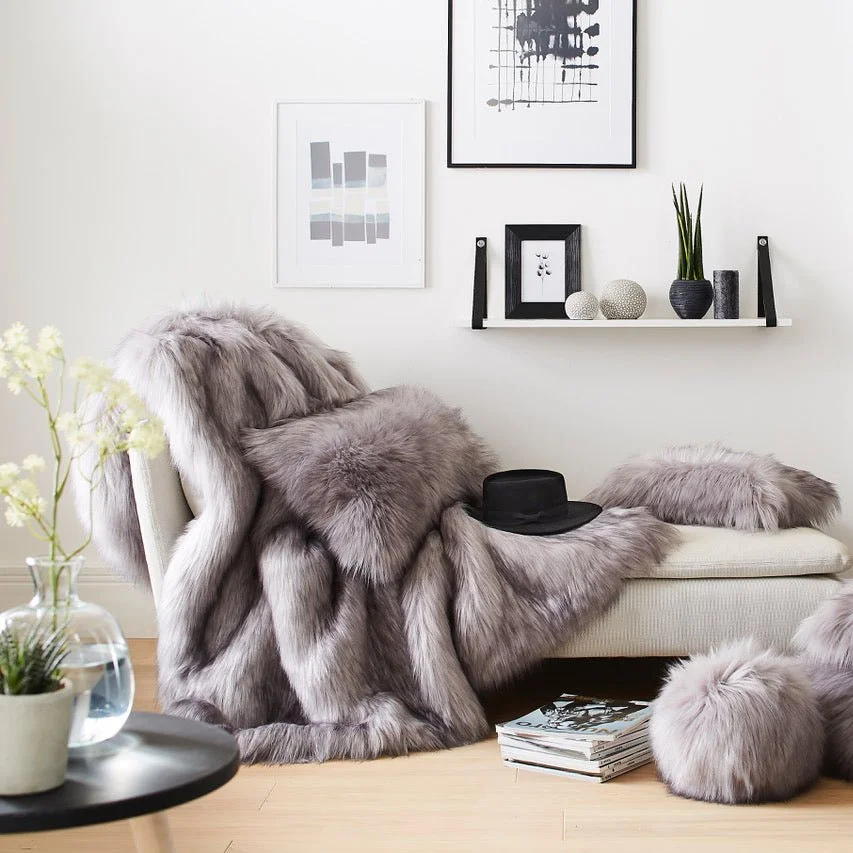 Evelyne Prélonge faux fur throw draped over a chaise in a living room