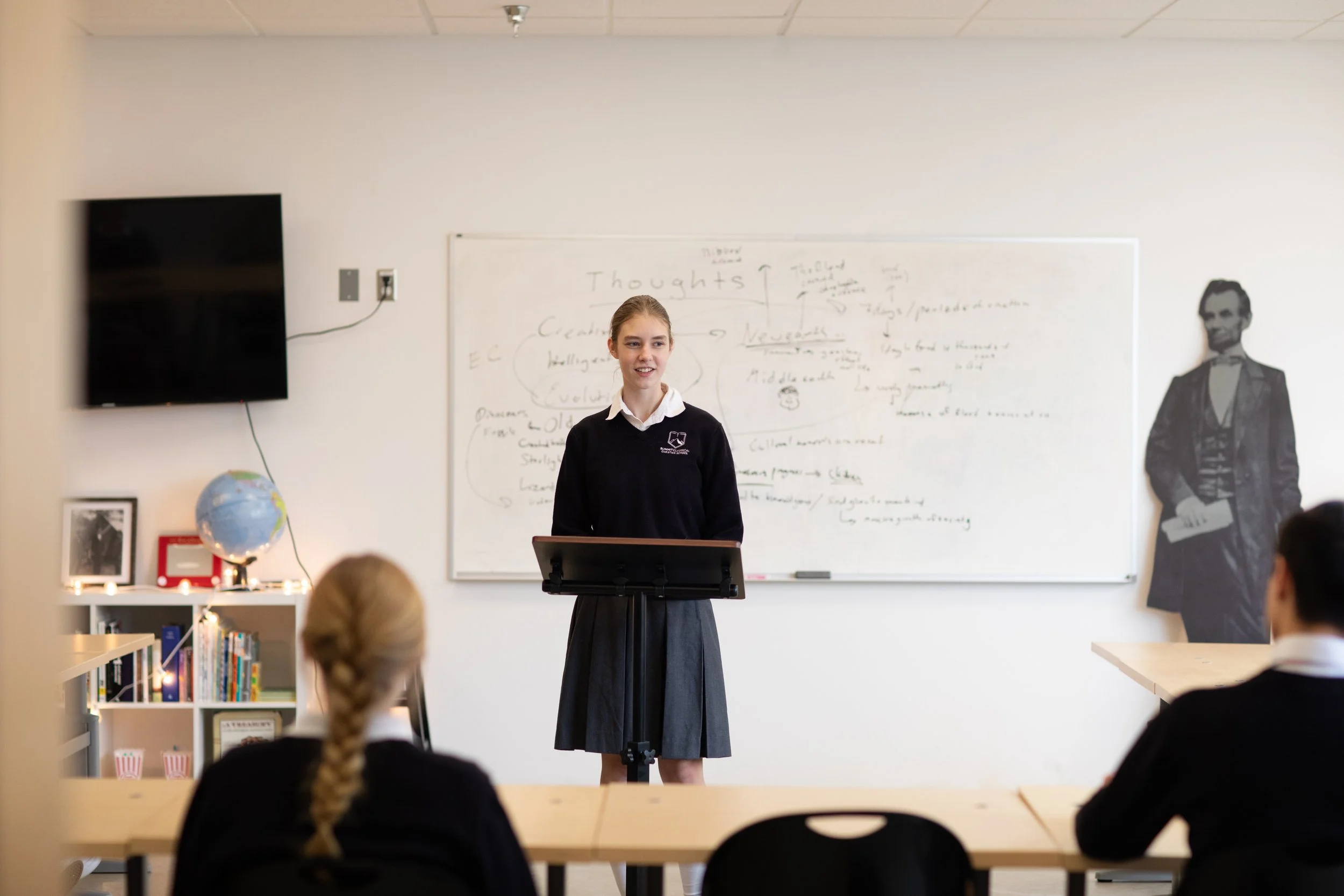 Summit student leading a class discussion at the whiteboard