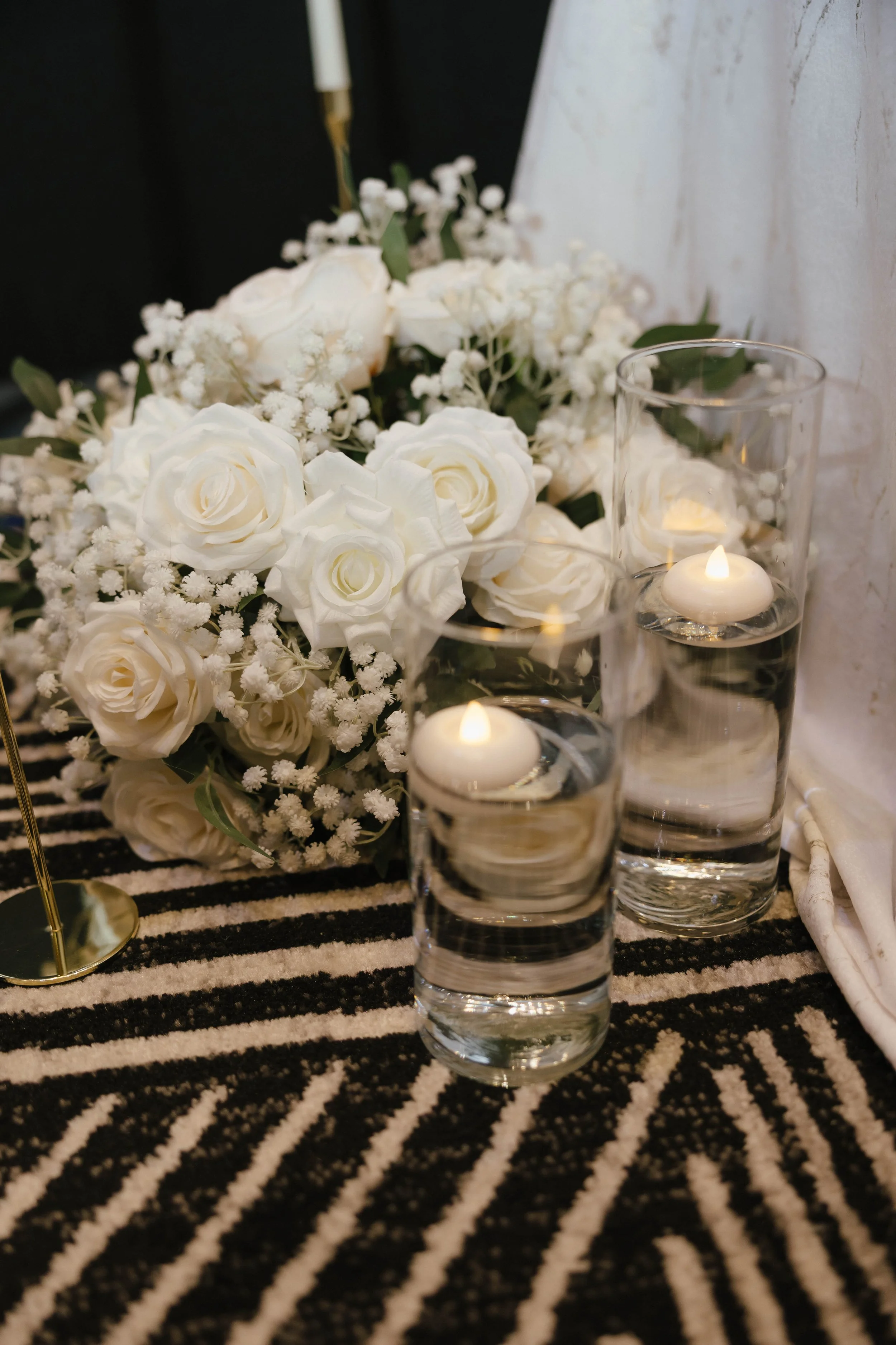Romantic candlelight and white floral styling for an elegant wedding tablescape.