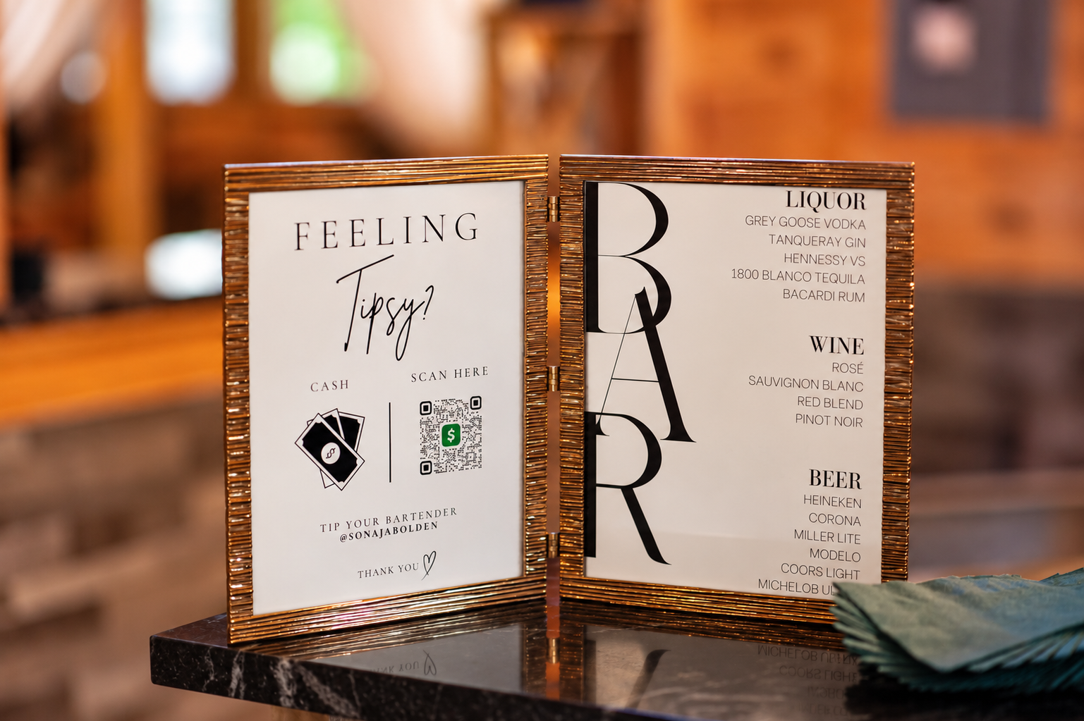Custom bar signage with personalized details for an elegant 60th birthday celebration.
