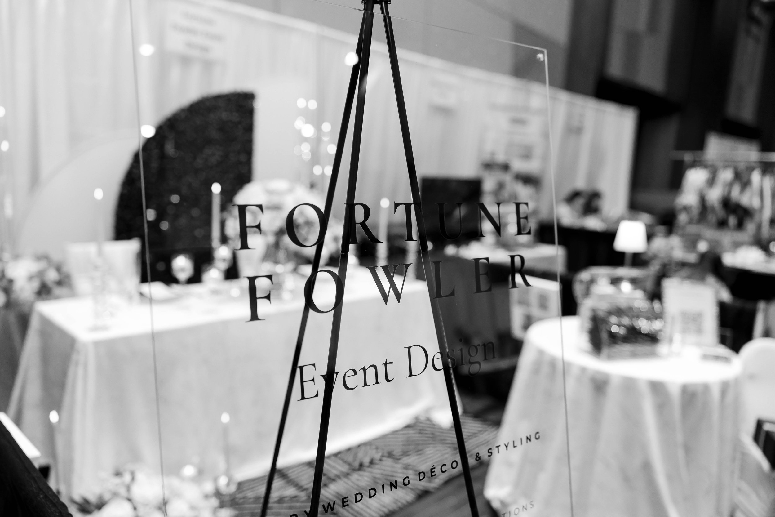 Custom-designed Fortune Fowler acrylic signage featuring signature wedding décor and styling.