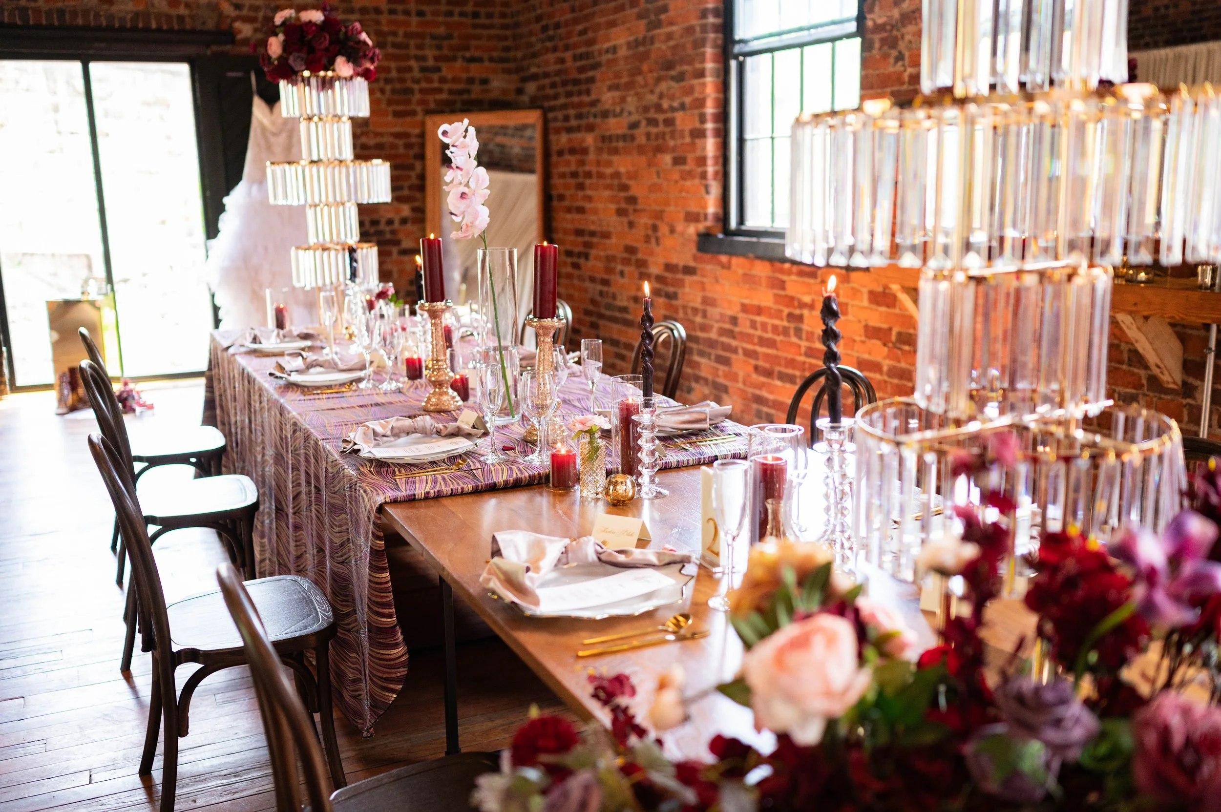 Elegant wedding tablescape with statement centerpieces and layered details at The Wool Factory.