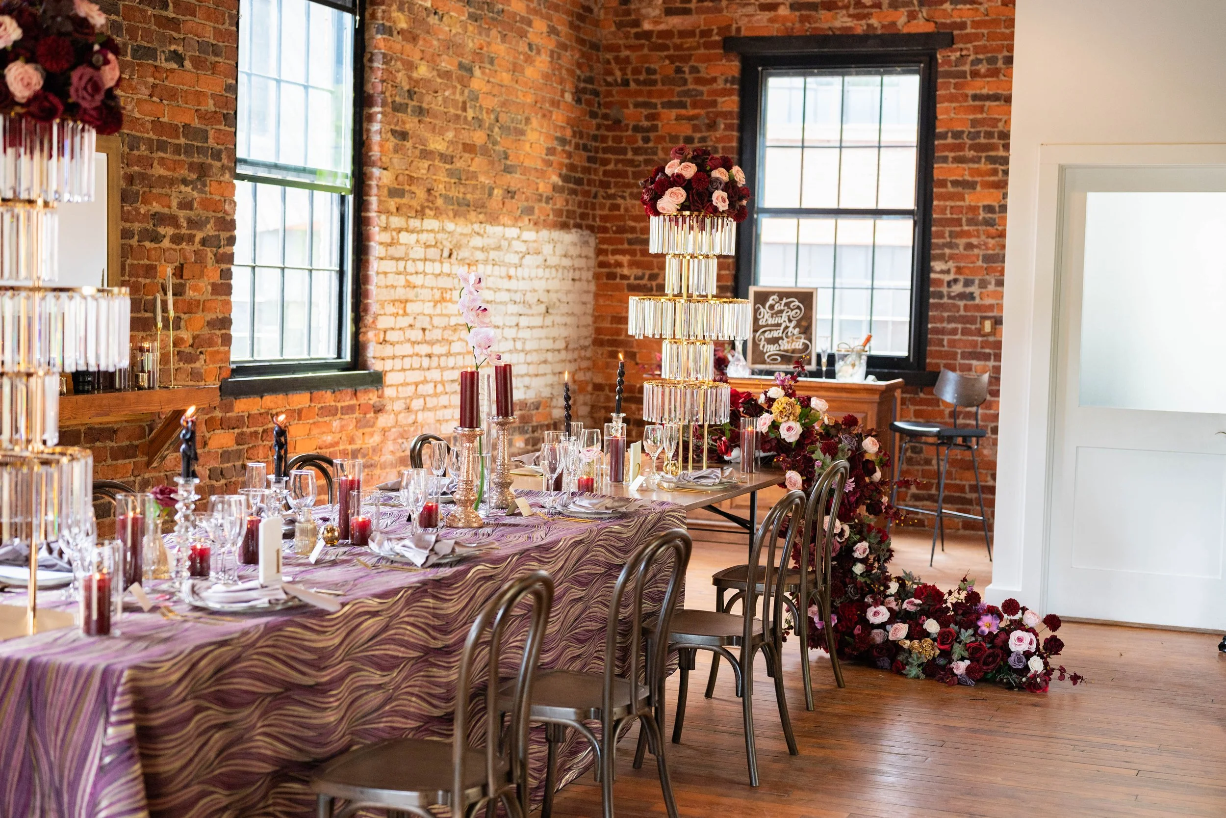 Elegant wedding tablescape with statement centerpieces and layered details at The Wool Factory.