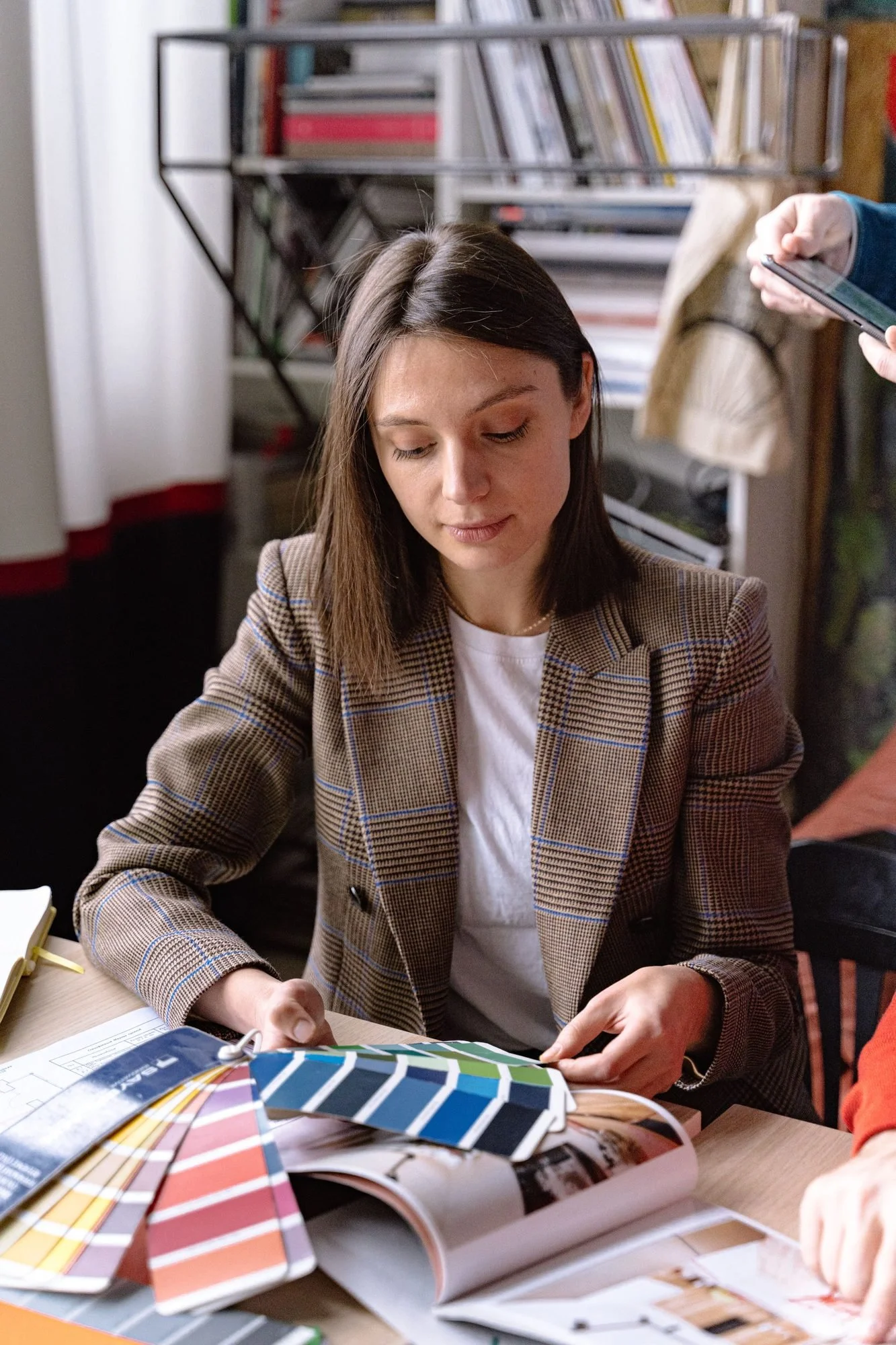 Designer reviewing color and material samples at a work table