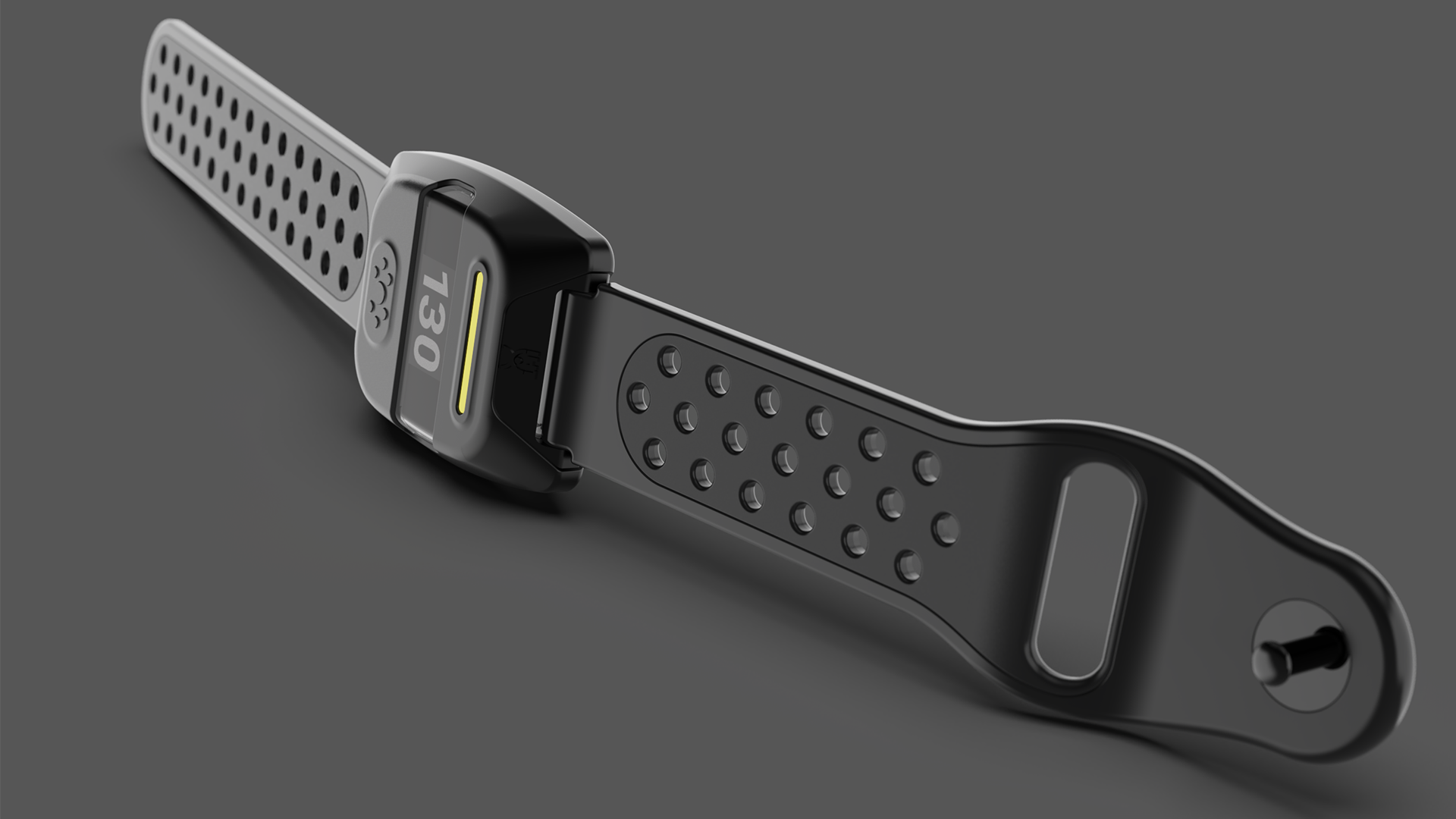 A close-up view of a fitness tracker wristband with a digital display showing the number 130, lying on a dark surface.