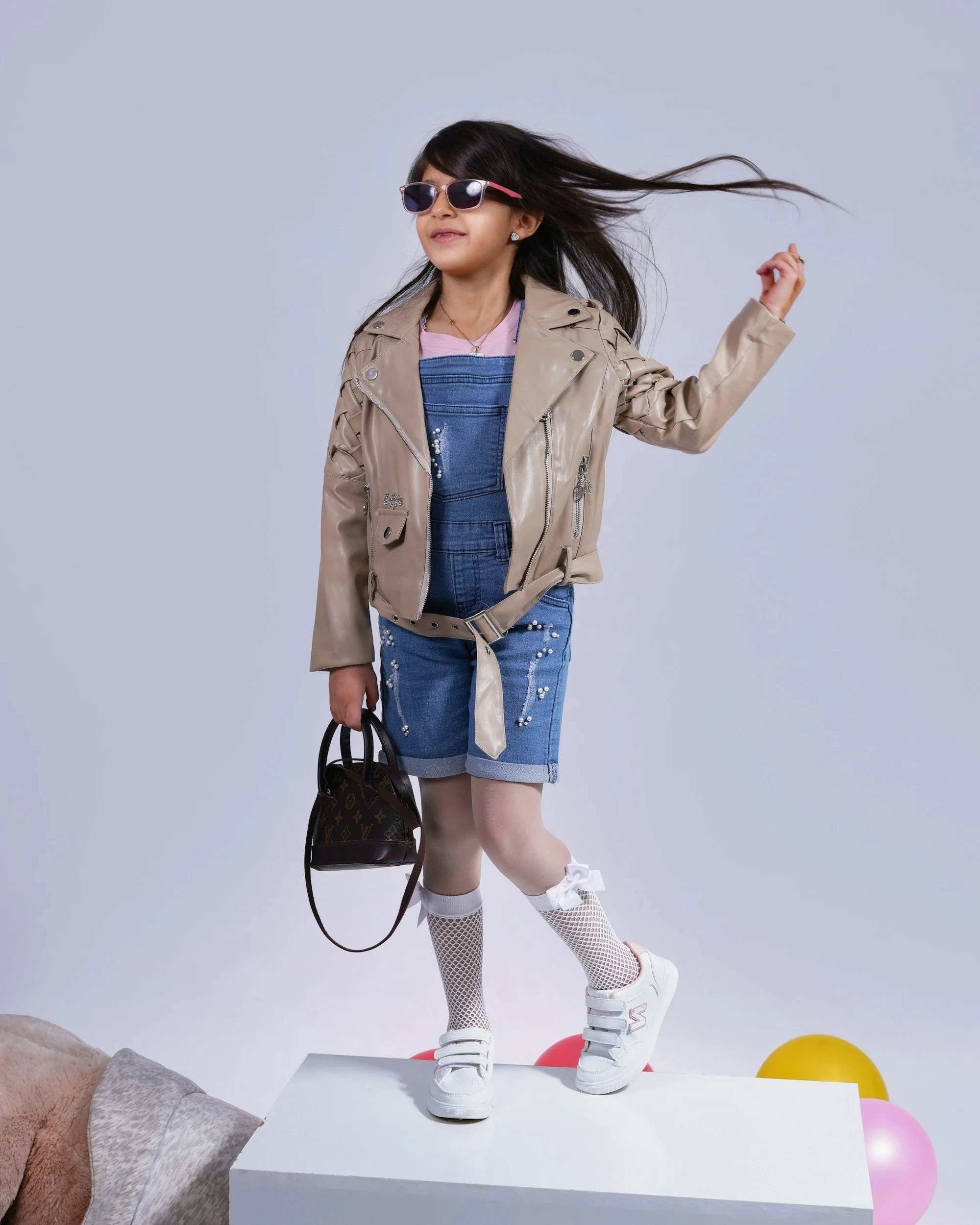 Girl in a neutral outfit in a studio