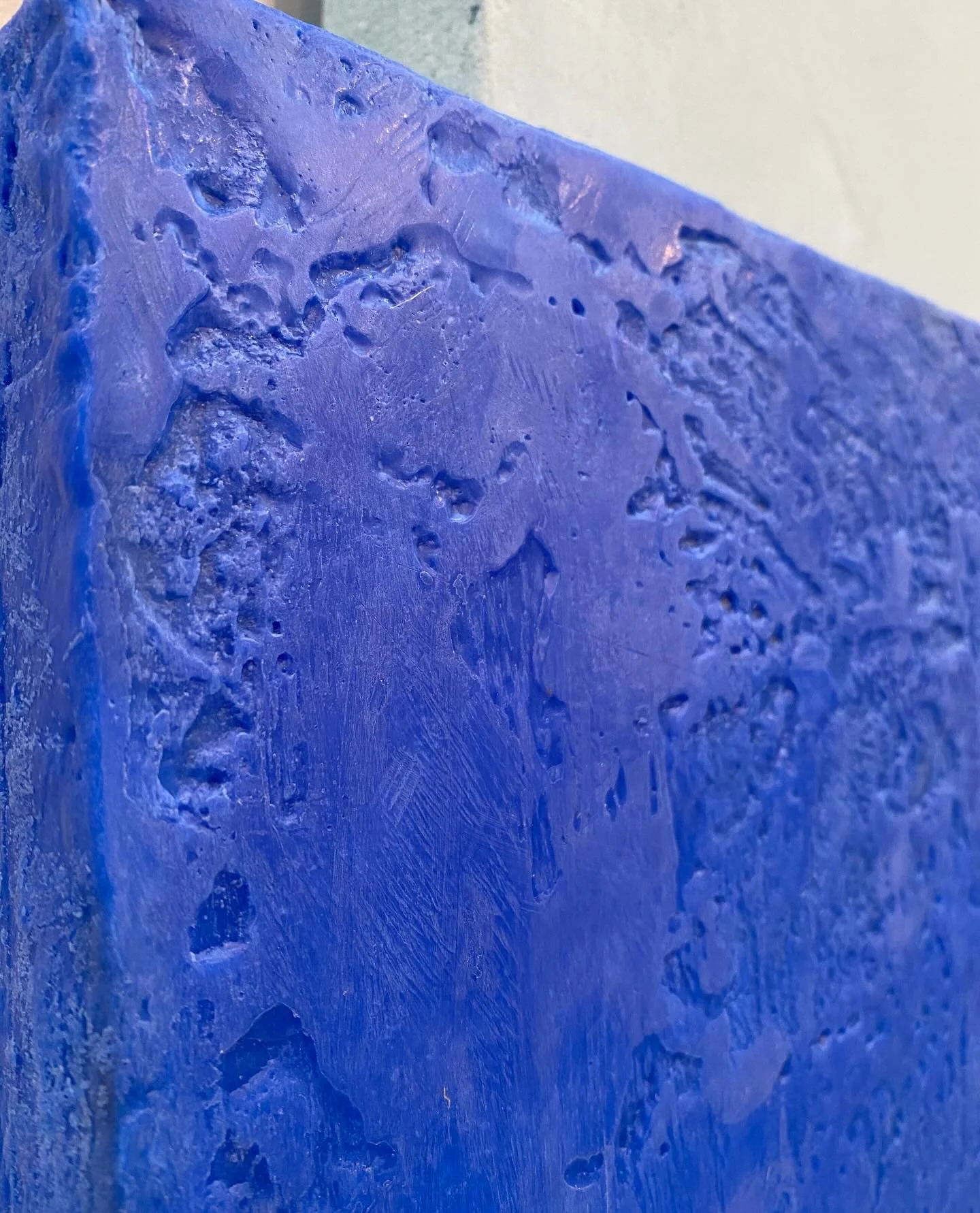 Close-up of a blue textured wall or surface.