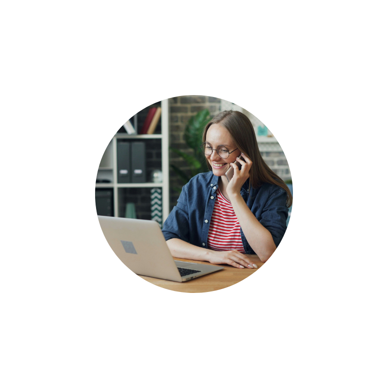 Virtual admin on the phone at a laptop, documenting admin procedures for a practice management manual