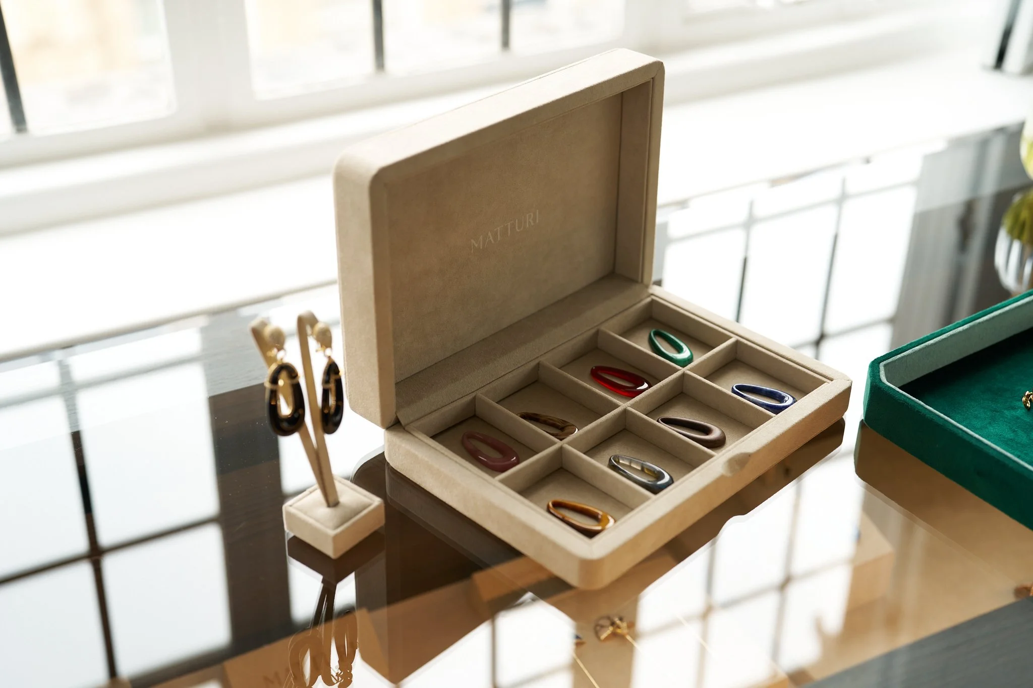 Matturi jewellery displayed in a presentation box beside the boutique window