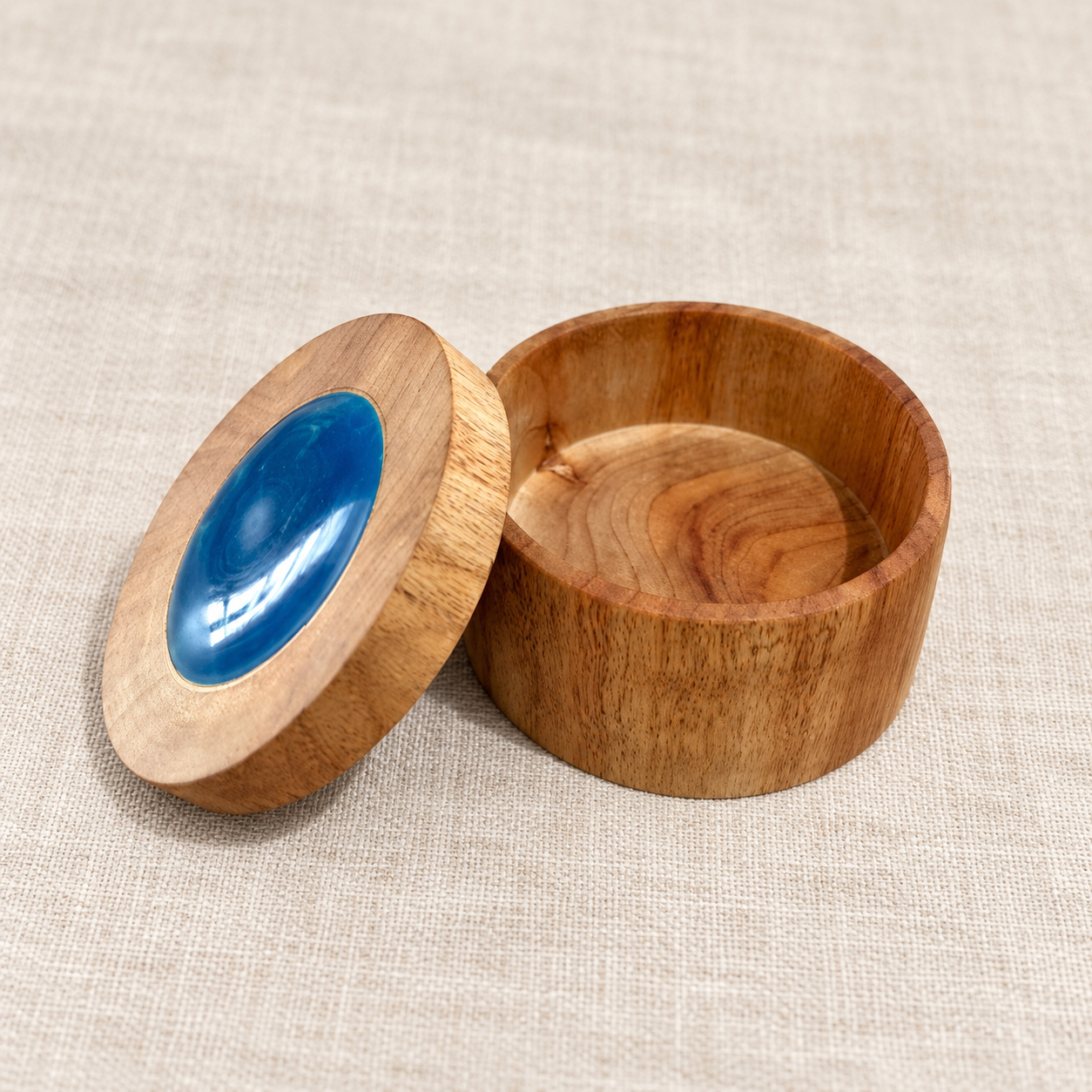 Open Camphor Laurel timber trinket box showing removable blue resin insert lid and storage compartment