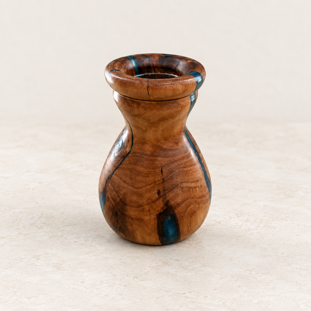 Australian hardwood and blue resin hand-turned vase on warm linen