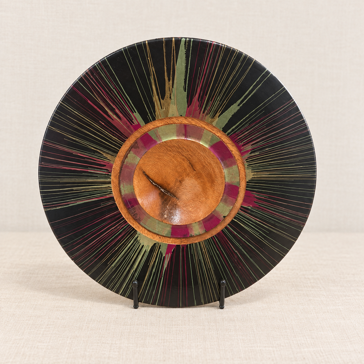 220 mm Silky Oak centrifugal decorative plate with green and burgundy detail on display stand