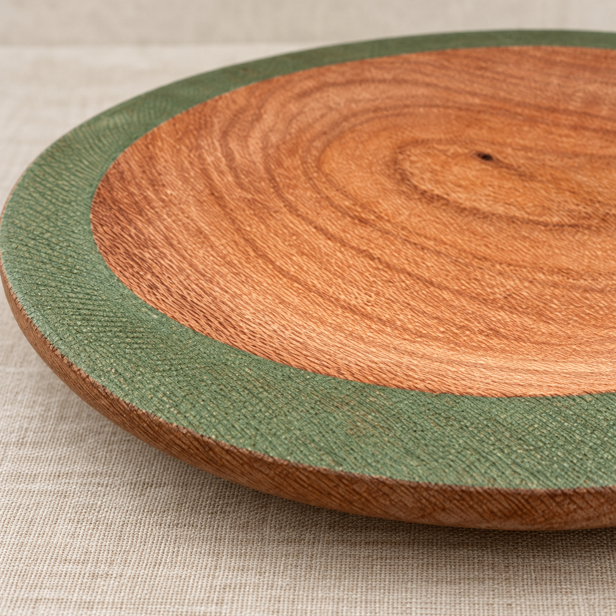 Close-up of Silky Oak grain and broad olive-green bowl rim
