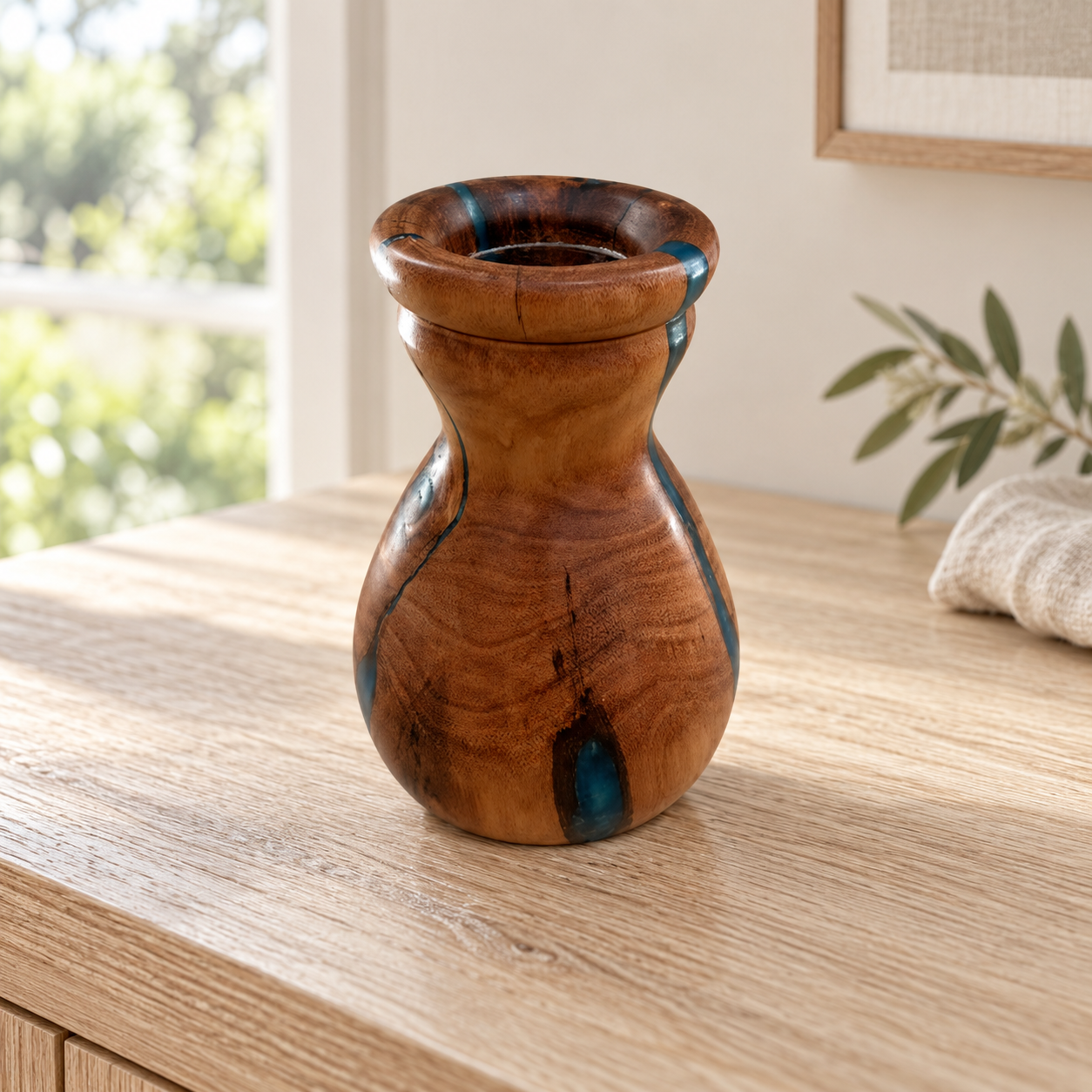 Blue resin and Australian hardwood vase on a pale timber console