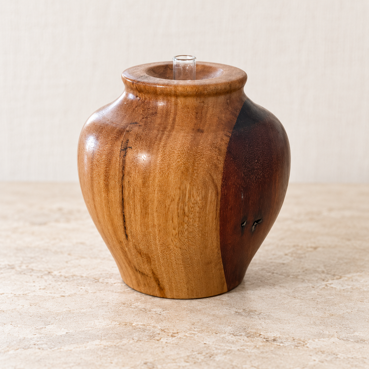 Spotted Gum and Red Gum hand-turned vase with gloss finish and glass tube insert, shown in full.