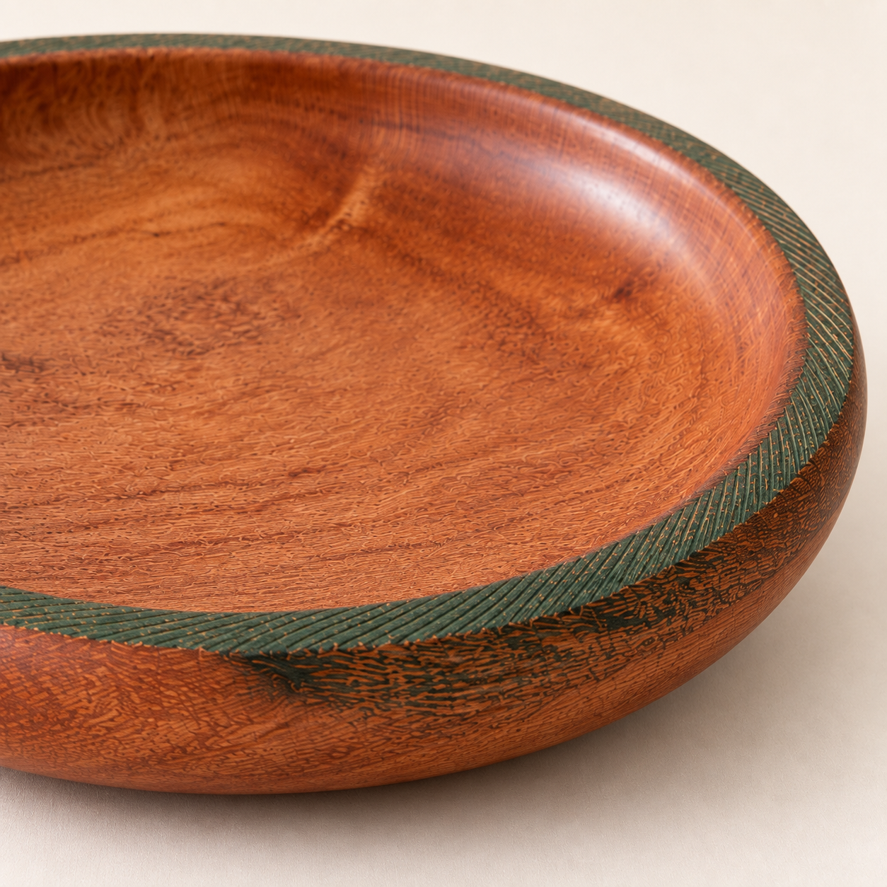 Close-up of the Olive Green Turned Bowl showing Silky Oak grain and the textured olive green rim