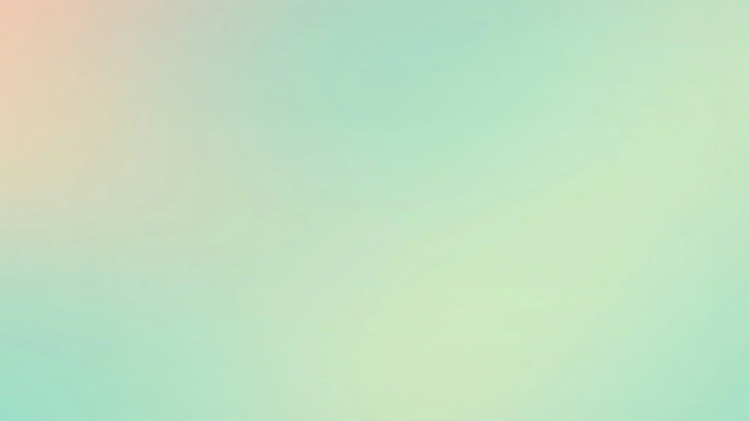 A blurry gradient background with soft pastel shades of pink, green, and blue.