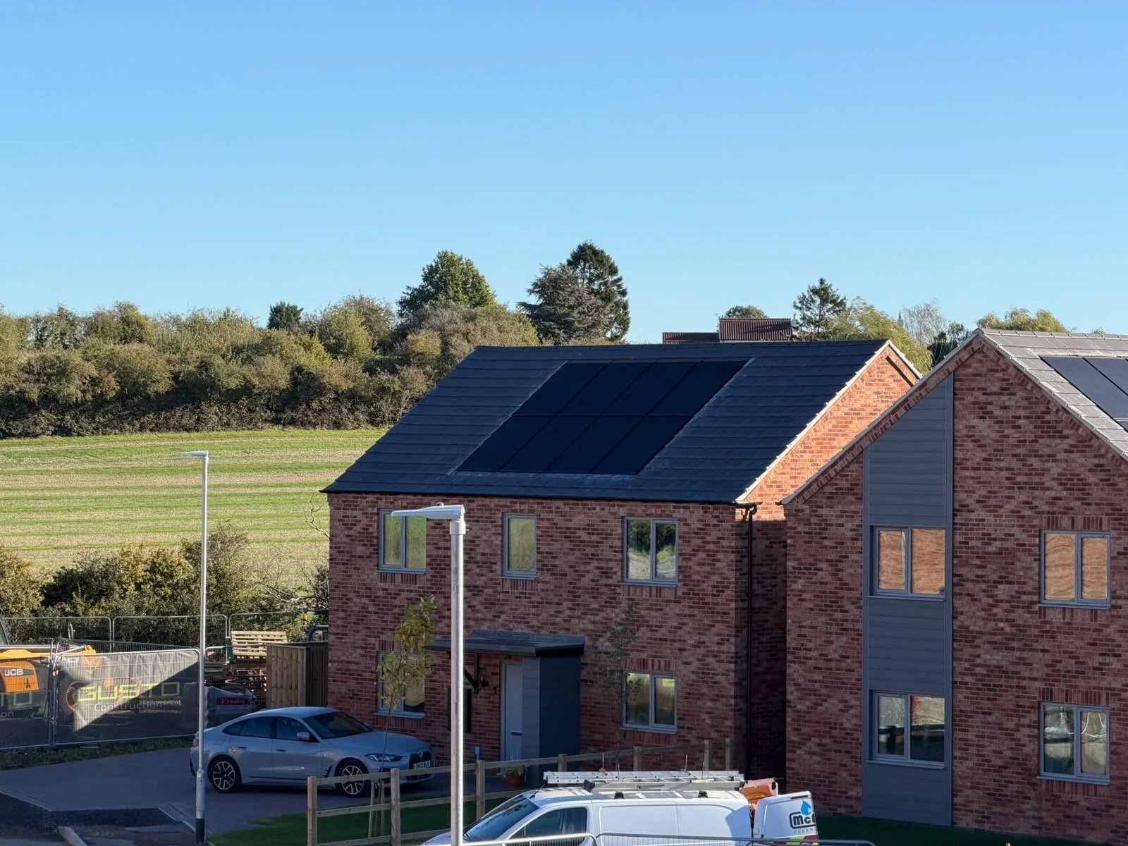 Oranssi technician working on a roof project