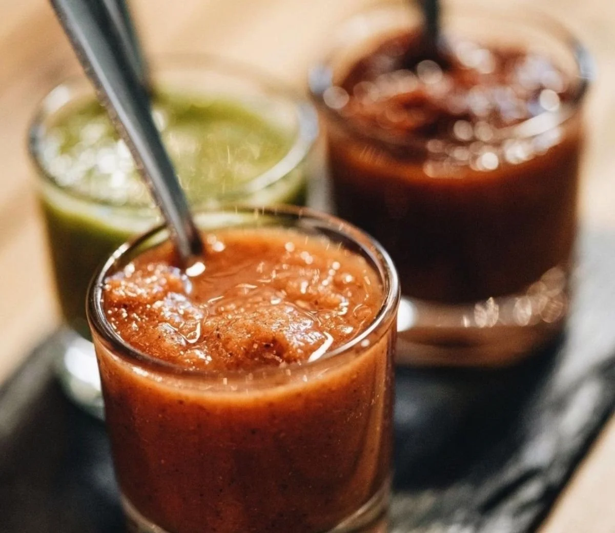 Selection of colourful Mexican salsas served in small bowls at Six Seis