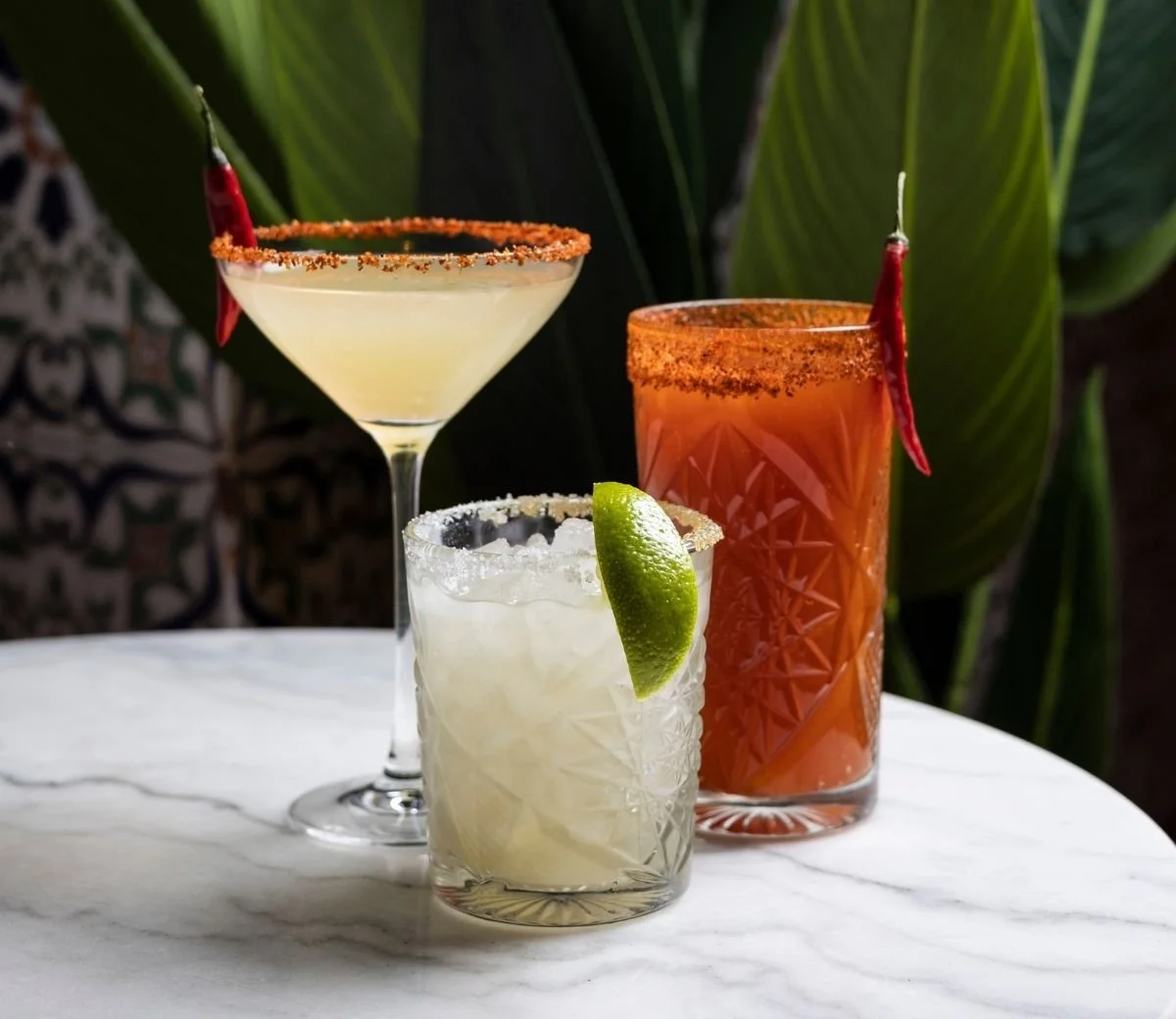Margarita and tall cocktails served with lime and chilli-rimmed glasses at Six Seis