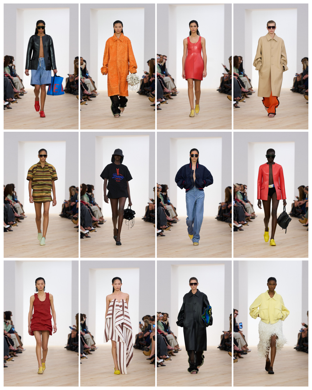 A fashion runway show featuring models in diverse clothing styles and accessories, walking on a wooden floor against a plain white backdrop with seated audience members on either side.