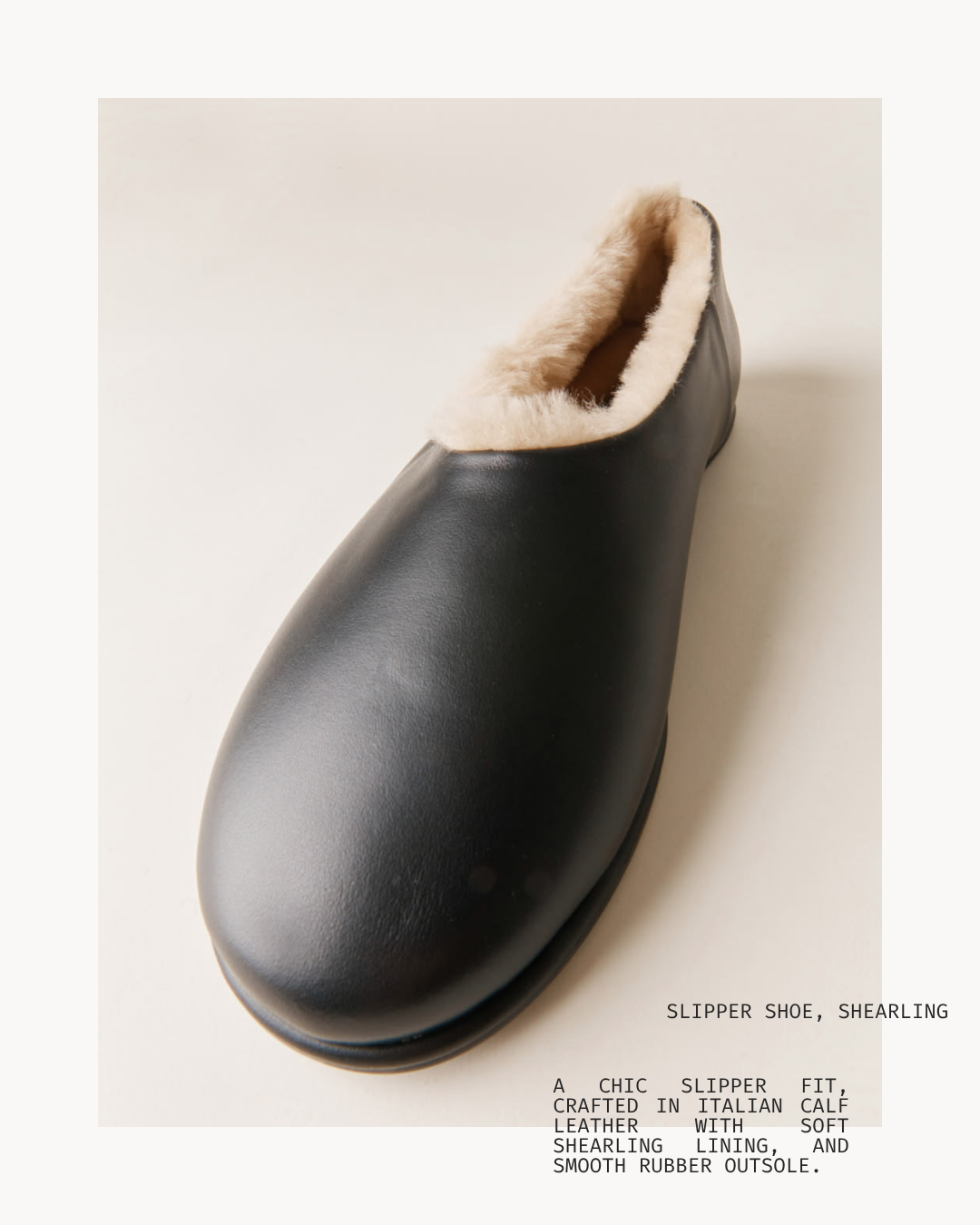 Black shearling-lined slipper with a smooth rubber outsole.