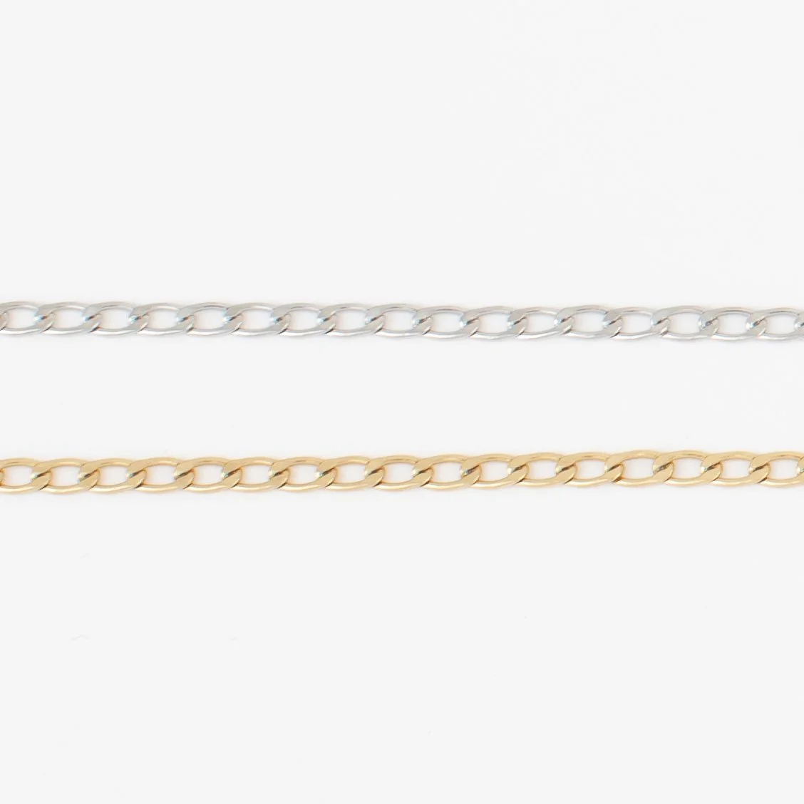 Curb chain permanent bracelet in silver and gold
