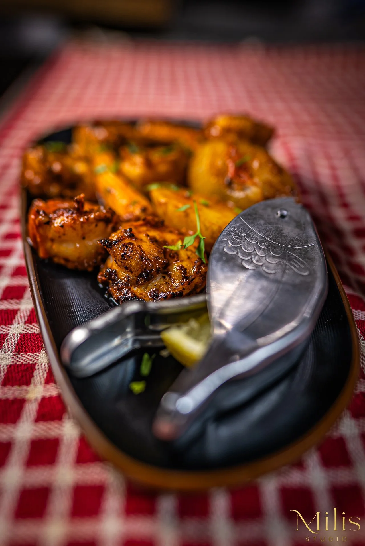 Restaurant food detail with serving utensils photographed by Milis Studio