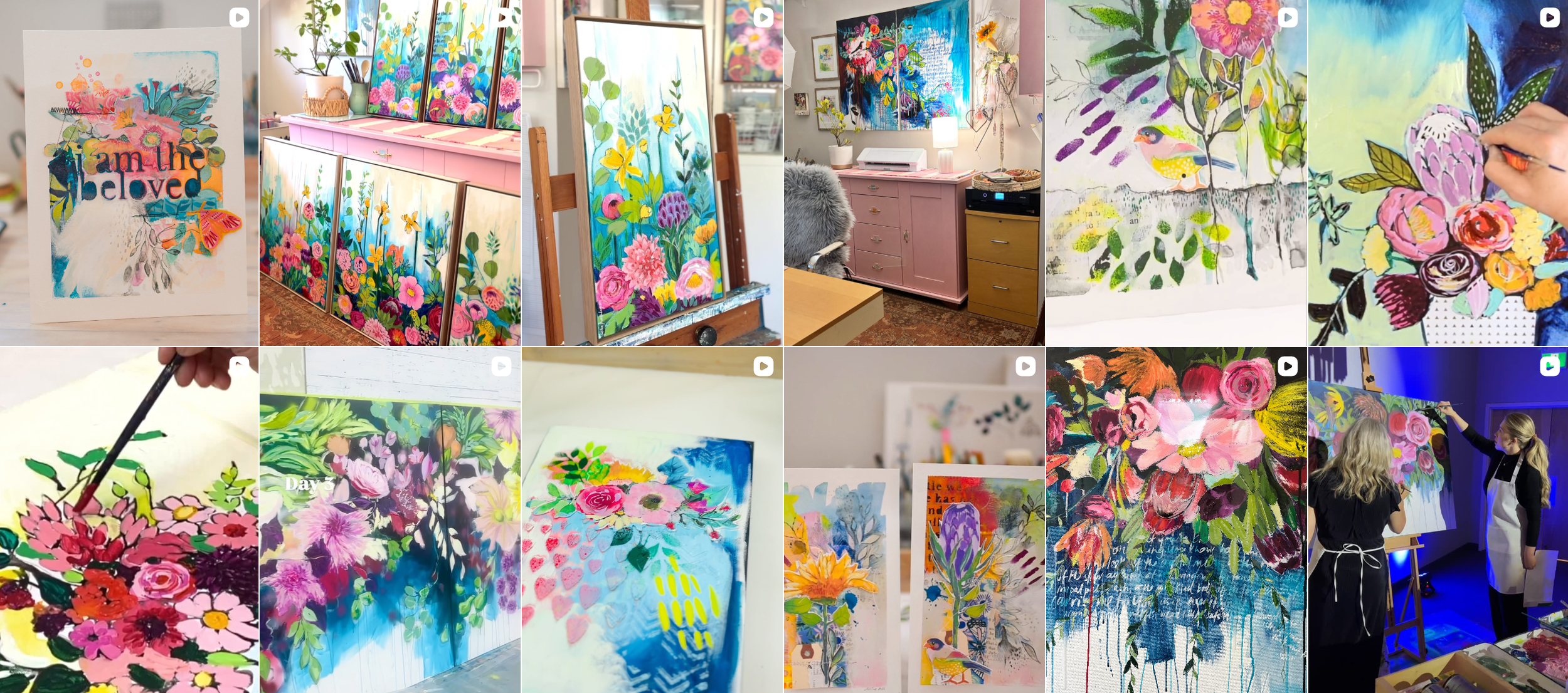 Collection of colorful floral paintings displayed in an art studio, with some artworks in progress and people working on their art.