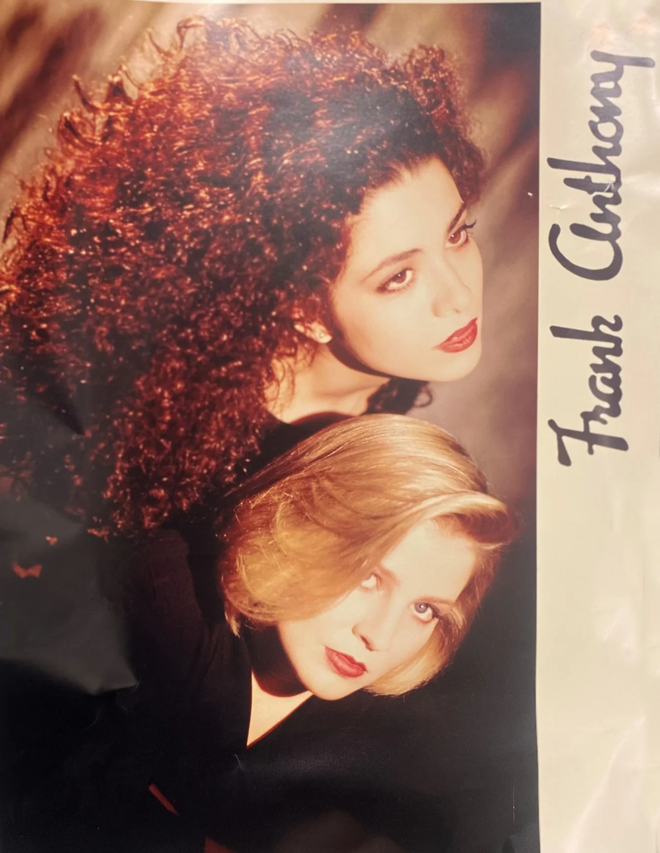 Two women with styled hair and makeup, one with curly red hair and the other with straight blonde hair, pose for a photo. The photo has stylized text that reads 'Thanks Charlotte'.