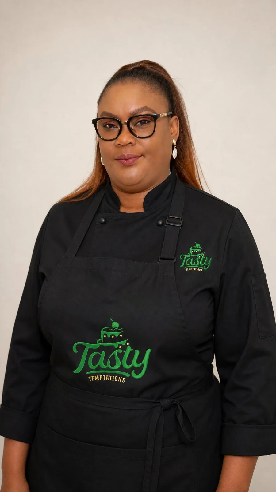 Yetty, owner and cake designer of Tasty Temptations, in her Tasty Temptations apron in Fulshear TX