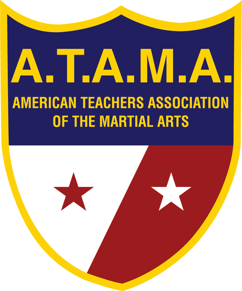 A shield-shaped logo with the acronym A.T.A.M.A. for the American Teachers Association of the Martial Arts, featuring a blue top section with yellow text and two star symbols, and a lower section divided into white and red parts with additional star symbols.