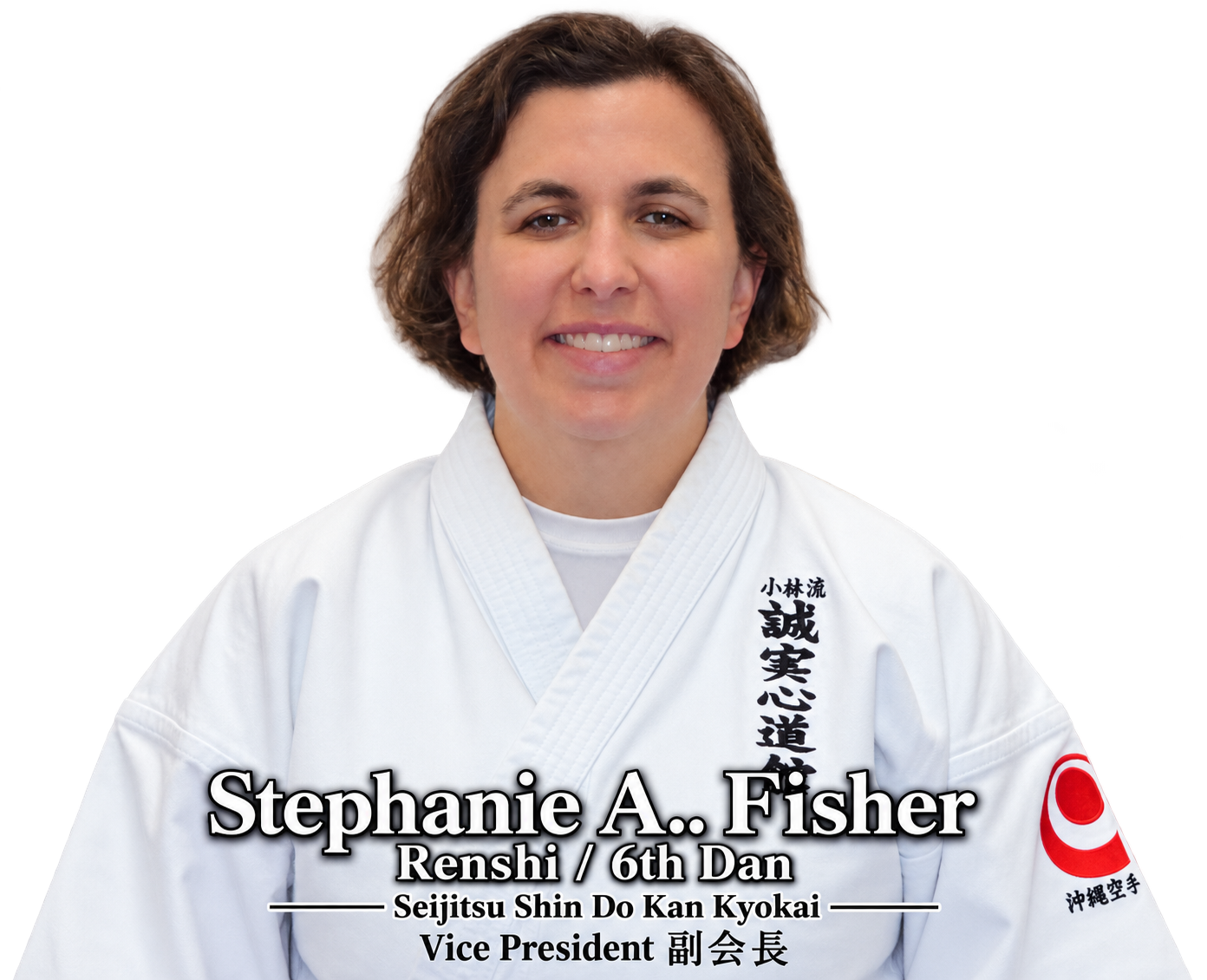 Portrait of a woman in a white martial arts gi with black Japanese characters on the right side, a red and white patch on the left sleeve, and smiling with short brown hair. Text overlay identifies her as Stephanie A. Fisher, 6th Dan Renshi, Vice President of Seijitsu Shin Do Kan Kyokai.