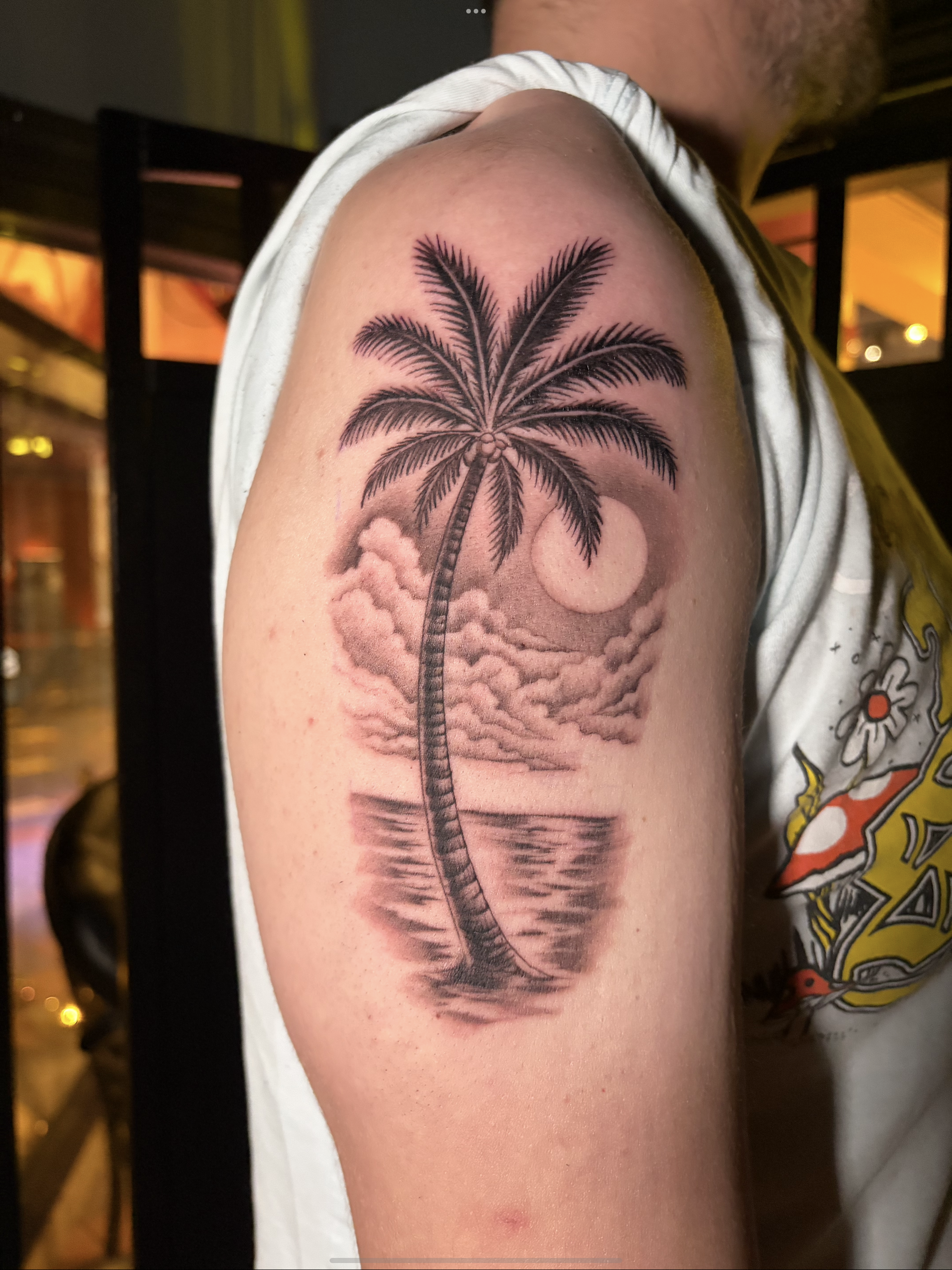 Blackwork palm tree and full moon tattoo by Gonzalo Chavez