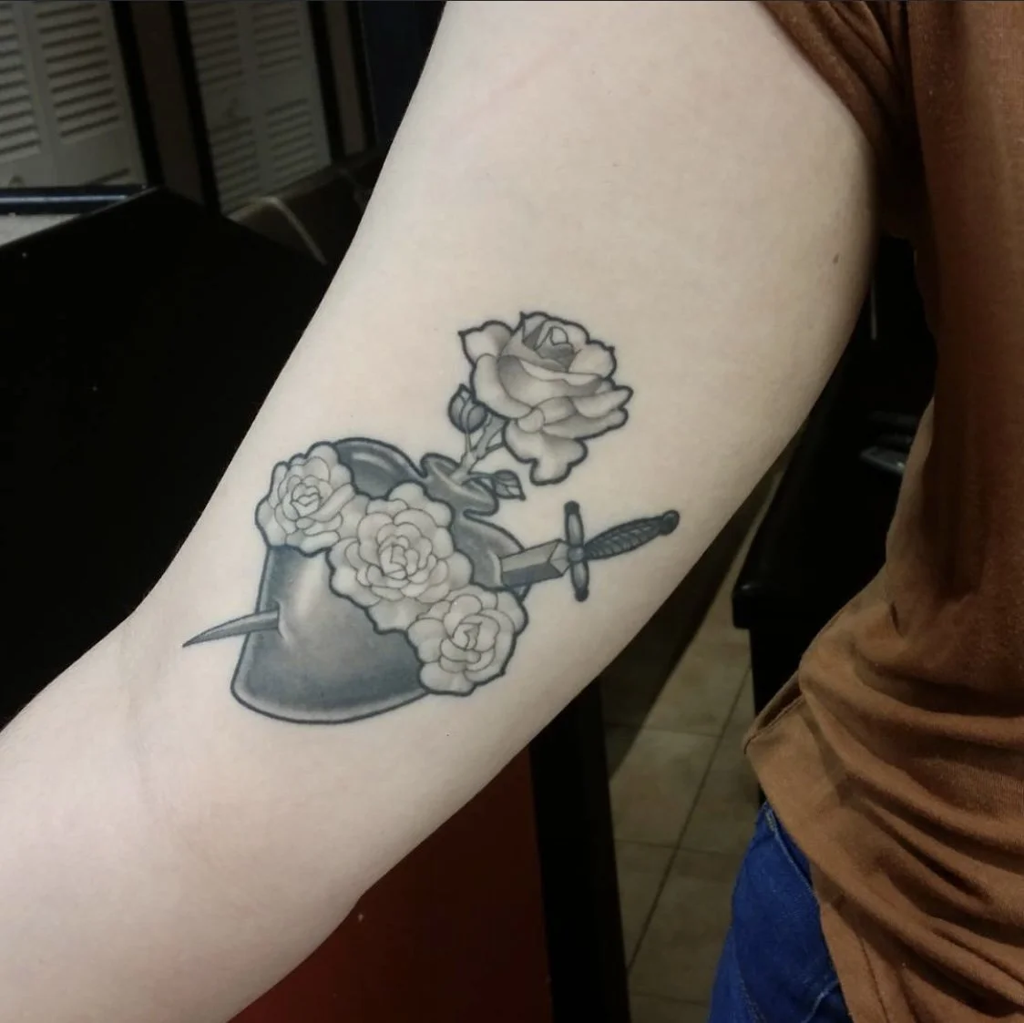 ⁠Heart dagger and roses tattoo by Gonzalo Chavez