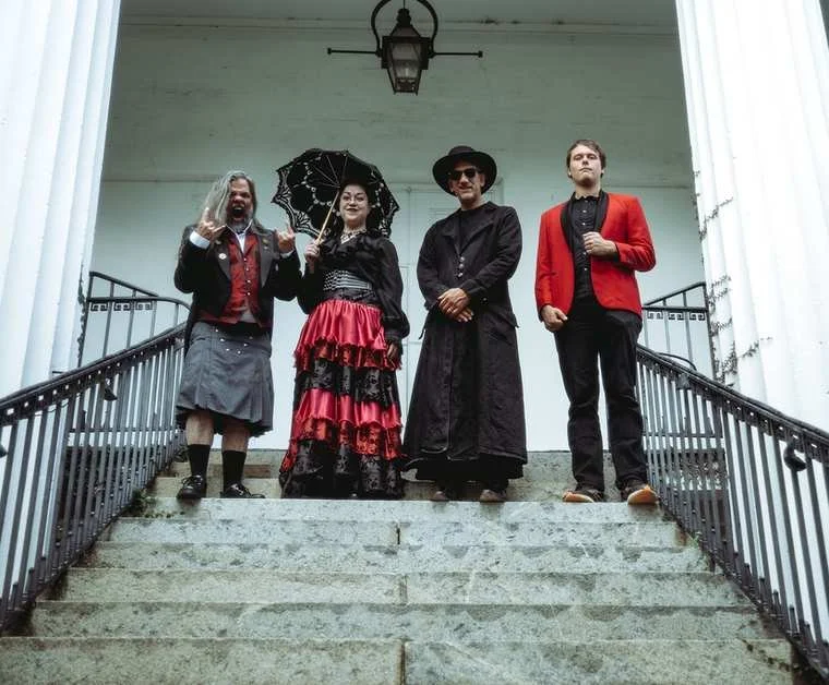 Southern Gothic Opera Company on the steps of a columned porch