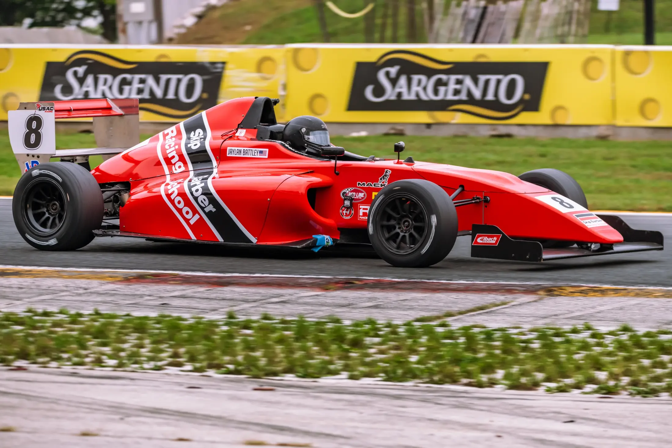 Jaylan Battley at speed in the number 8 Skip Barber formula car at Road America