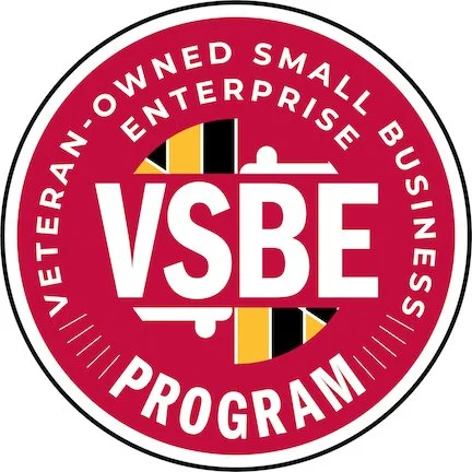 Circular logo with a red border and white background, featuring the text "VSBE" in the center, and labels "Veteran-Owned Small Business" and "Entrepreneurship Program" around the edge.