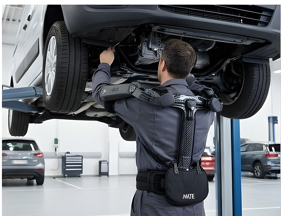 Automotive technician working under a raised vehicle while wearing MATE XT-GO