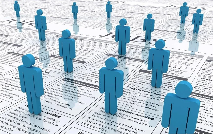 Multiple blue 3D humanoid figures standing on scattered newspaper pages.