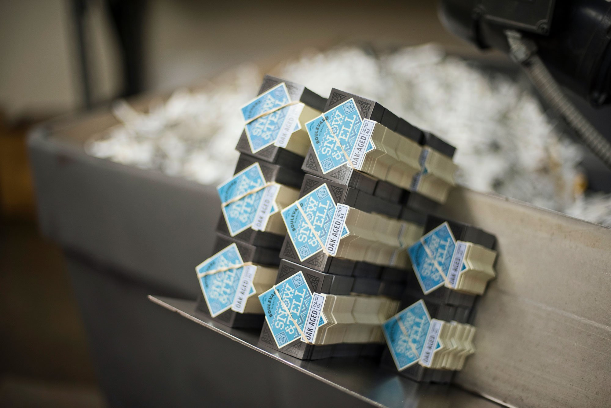 Bottles of beer labels stacked.