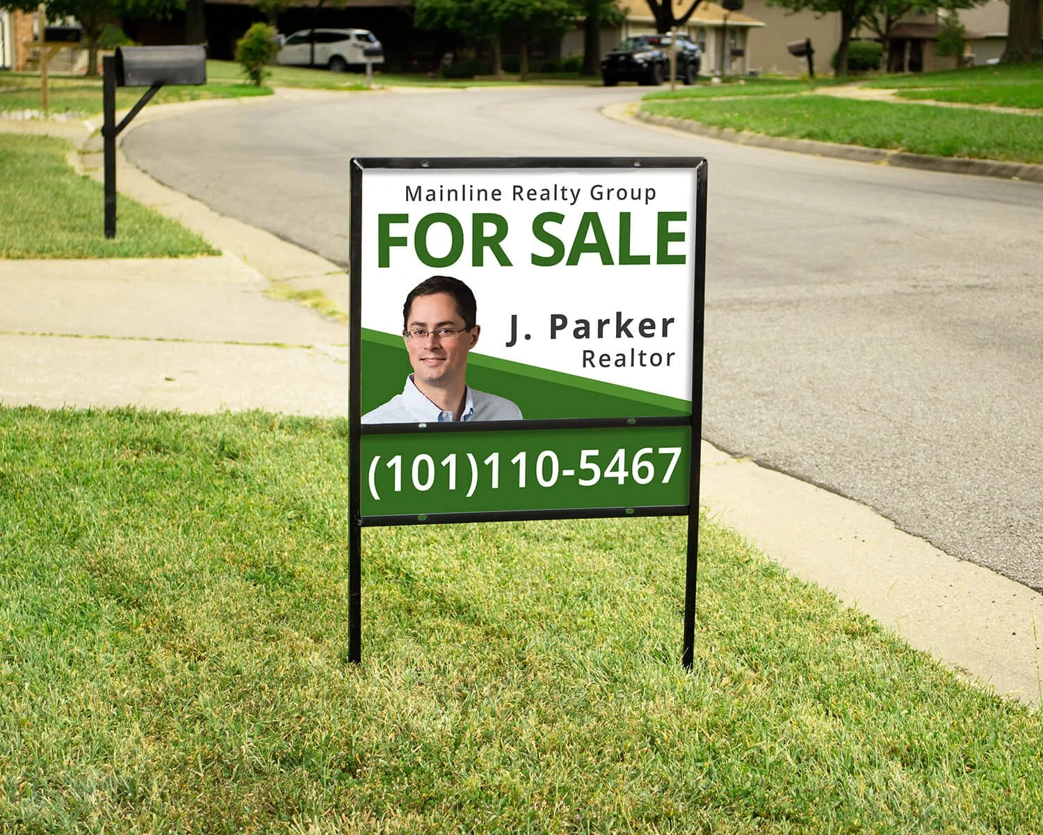 Yard sign advertising a house for sale by Mainline Realty Group featuring realtor J. Parker with a photo of him and a phone number.