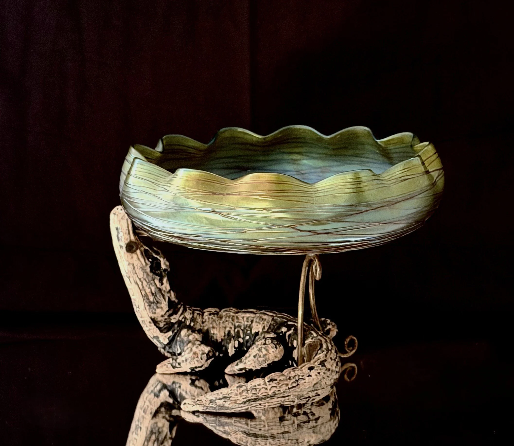 A Bohemian center piece (Loetz - Harrach) early 20th century on a ceramic Alligator