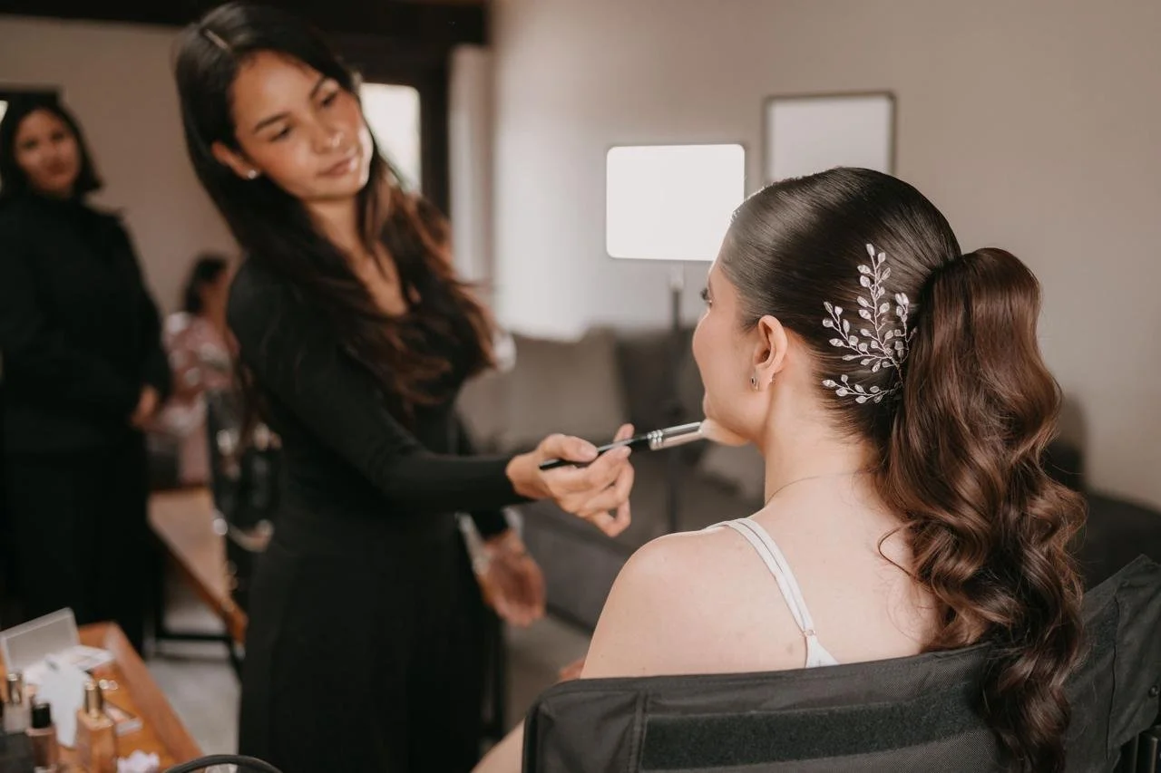 Bridal ponytail with a pearl and leaf hair accessory