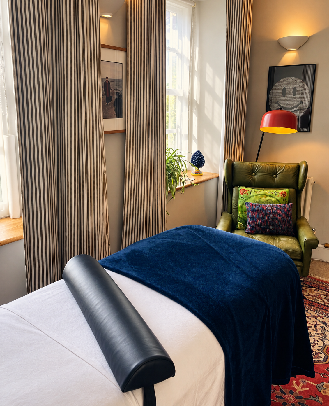 View of treatment room, treatment couch and chair